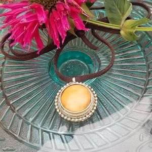 Vintage Enclosed Stone pendant on leather cord